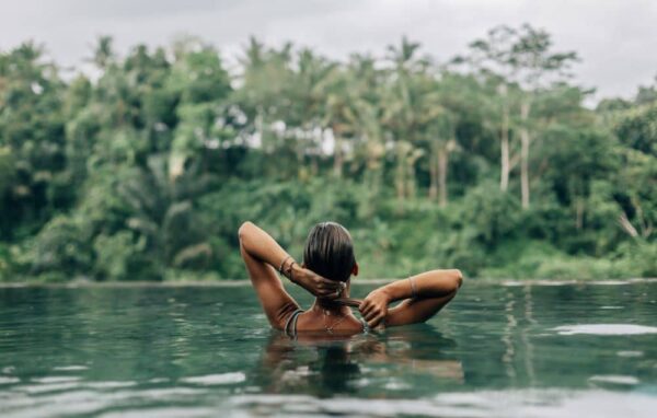 Swimming outdoors.
