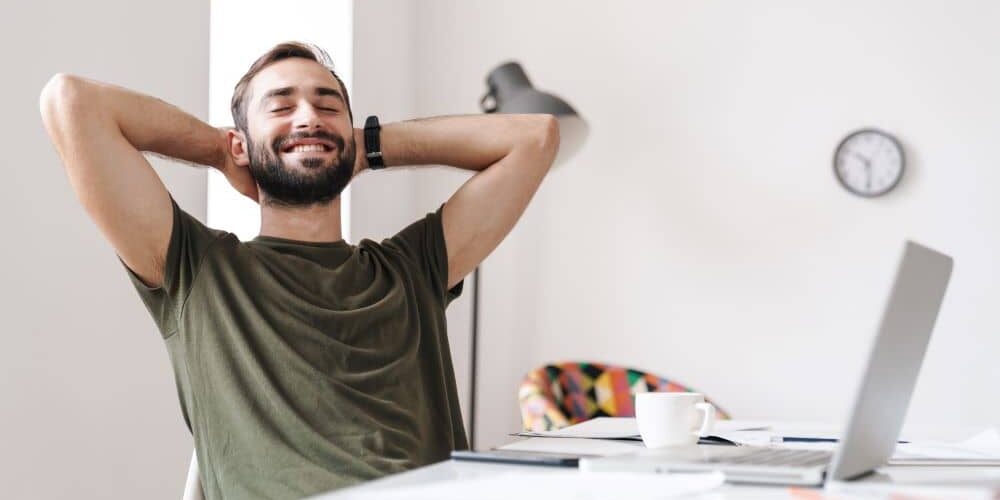 Man feeling relaxed at work. Man feeling relaxed at work.