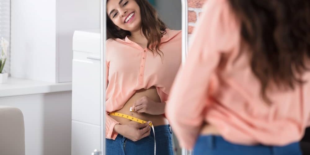 woman-measuring-waist Losing weight, getting healthy and regaining your self confidence leads to unlocking an extraordinary life.